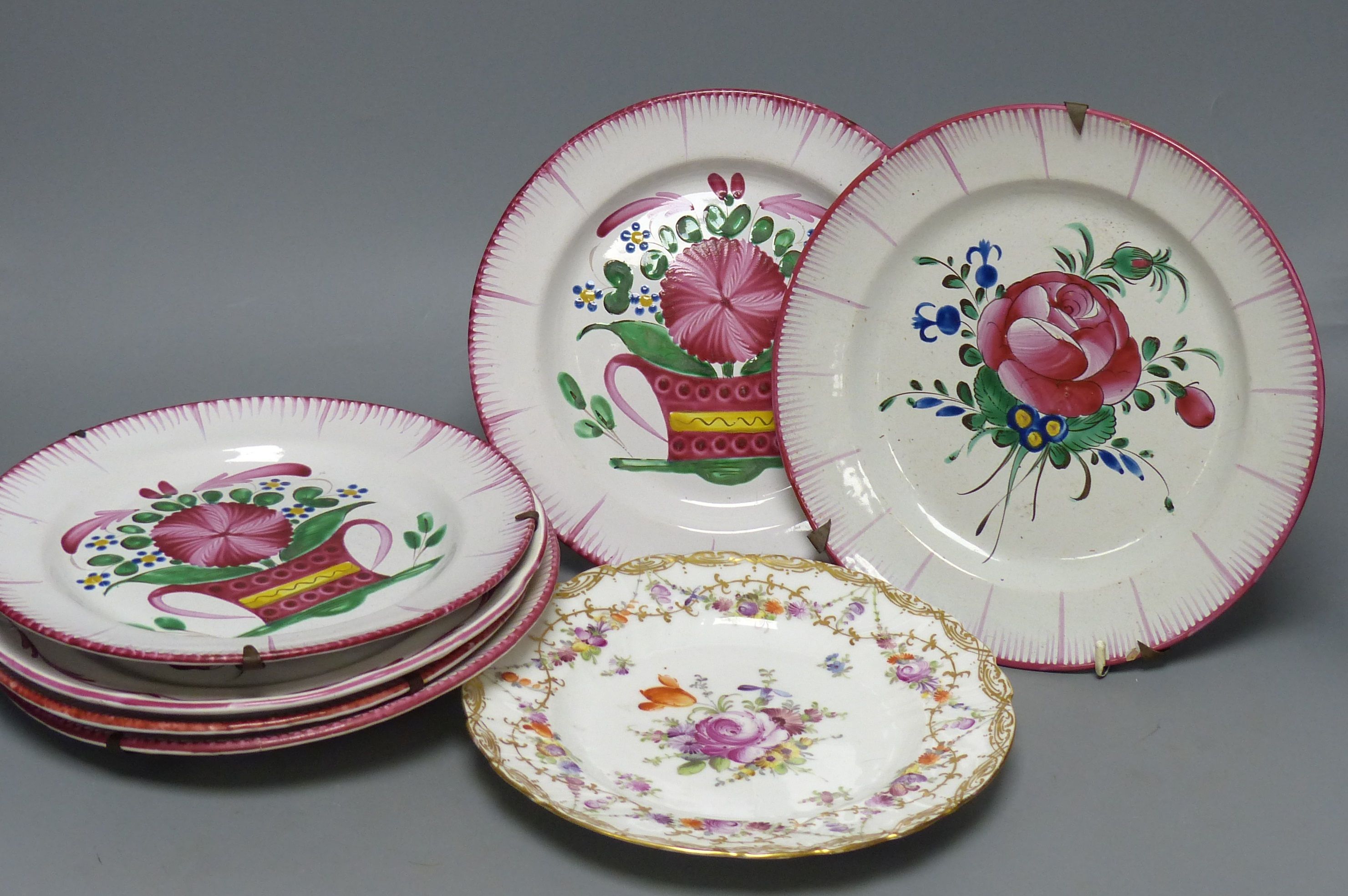 Seven French faience plates and a Dresden plate